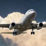 A commercial airplane flying through dramatic clouds, showcasing aviation in action.